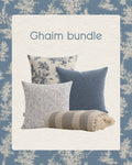 Ghaim bundle of pillows and a blanket on a decorative background
